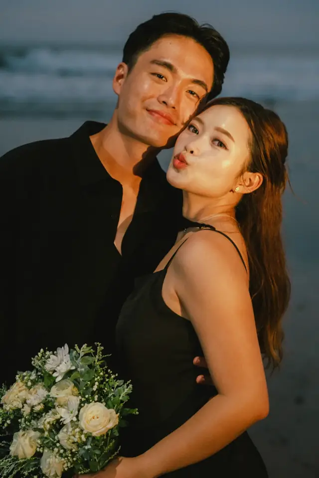 Playful couple portrait Bali beach